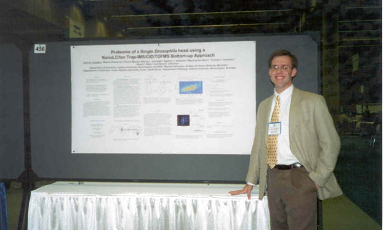 John Taraszka presenting during a poster session.