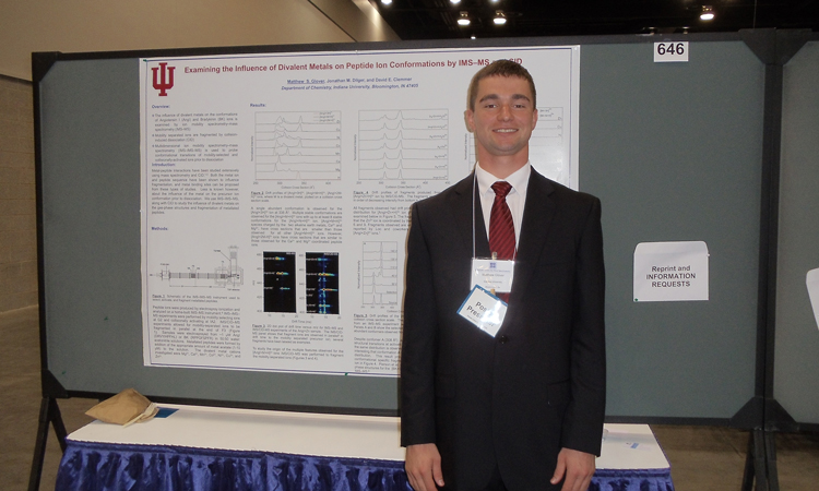 Matthew Glover presenting during a poster session.