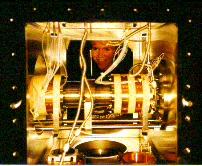 The injected ion drift tube is illuminated in the main vacuum chamber of the time-of-flight instrument.